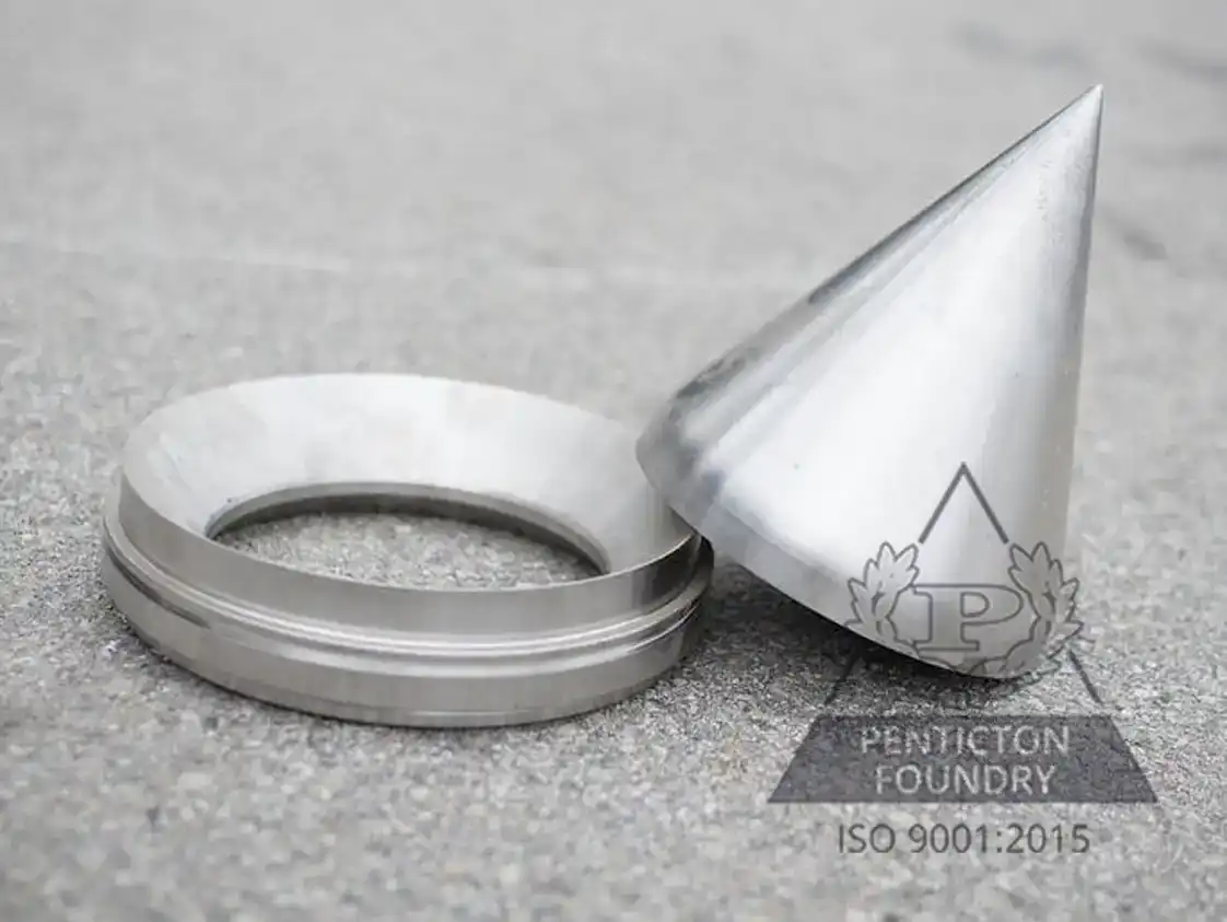 A high chrome white iron seat and a tip for a Pelton waterwheel for generating electricity. A high chrome white iron seat and a tip for a Pelton waterwheel for generating electricity.